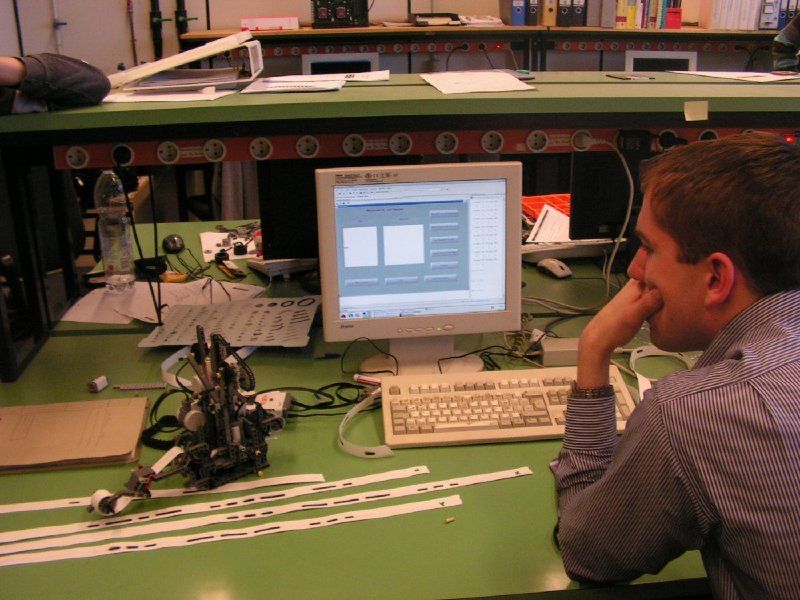 A student uses a MATLAB based GUI to control a robot that reads and writes Morse code