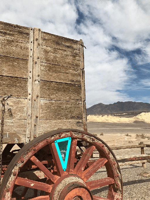 Cyan colored triangular ROI aligned with the spokes of a wagon wheel.